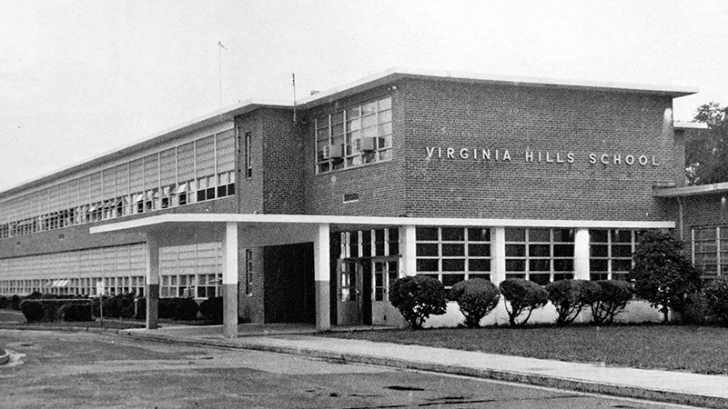 Black and white photograph of Virginia Hill Elementary School from this school’s 1971 to 1972 yearbook. The building is two-stories tall with an office suite near the main entrance. The building's egg-crate design, as described by architects, is very similar to Mount Eagle Elementary School which opened during the same time period. 